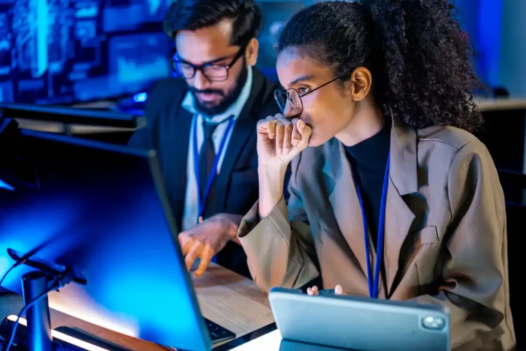 Focused Professional Team Working at Computers in a High Tech Office